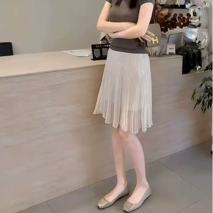 Jupe tendance printemps-été 2026 femme style streetwear cuir synthétique élégante mi-mollet empire ajustement Coupe régulière
