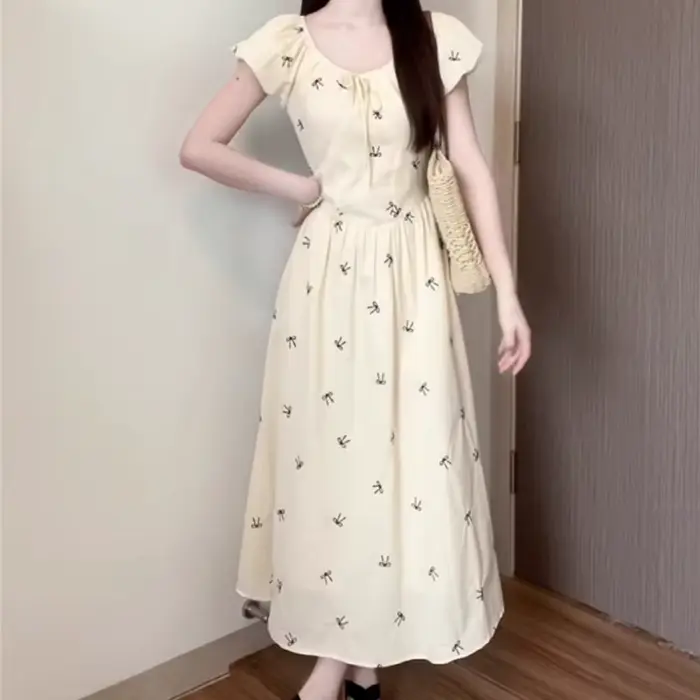 Robe longue imprimée nœud français pour femme été 2026 style à la française coupe trapèze manches bouffantes occasion spéciale vacances