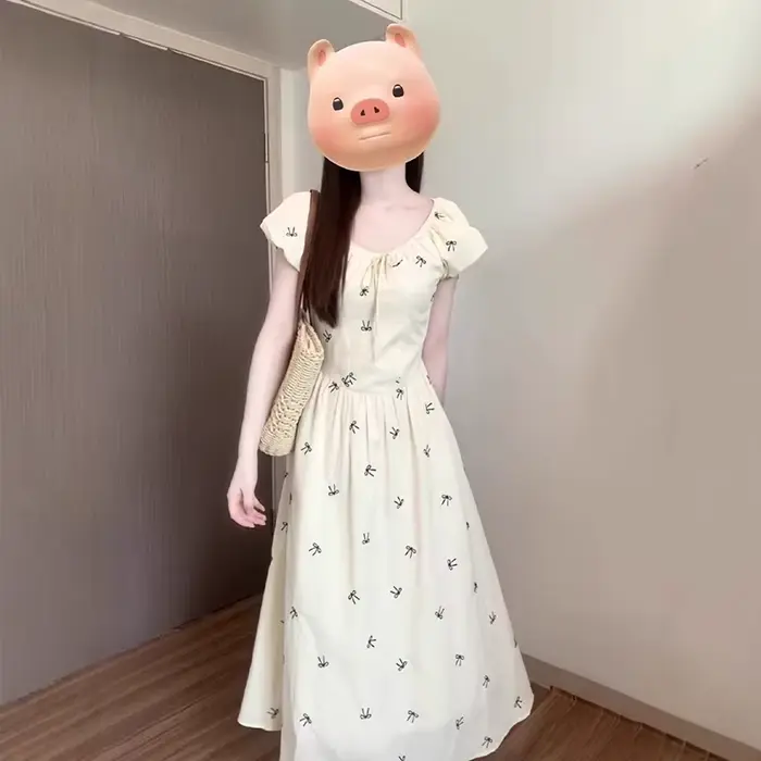 Robe longue imprimée nœud français pour femme été 2026 style à la française coupe trapèze manches bouffantes occasion spéciale vacances