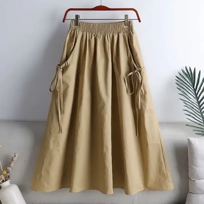 Jupe mi-longue élastique taille haute, style workwear, tendance été 2025, polyvalente, amincissante,