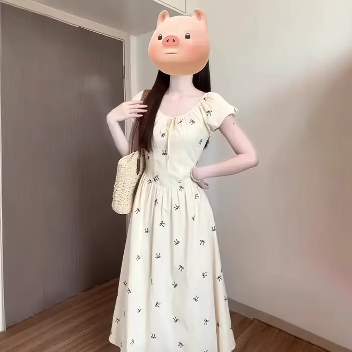 Robe longue imprimée nœud français pour femme été 2026 style à la française coupe trapèze manches bouffantes occasion spéciale vacances