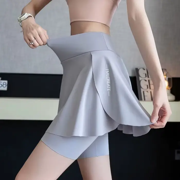 Jupe de tennis élastique pour femmes séchage rapide protection anti-exposition conception jupe faux deux pièces matériaux polyester construction sans couture occasions sportives et quotidiennes