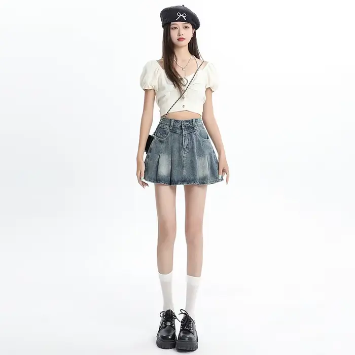 Jupe courte plissée en jean bleu taille haute pour femme